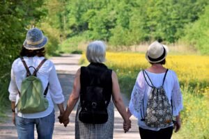 Group of women holding hands walking together