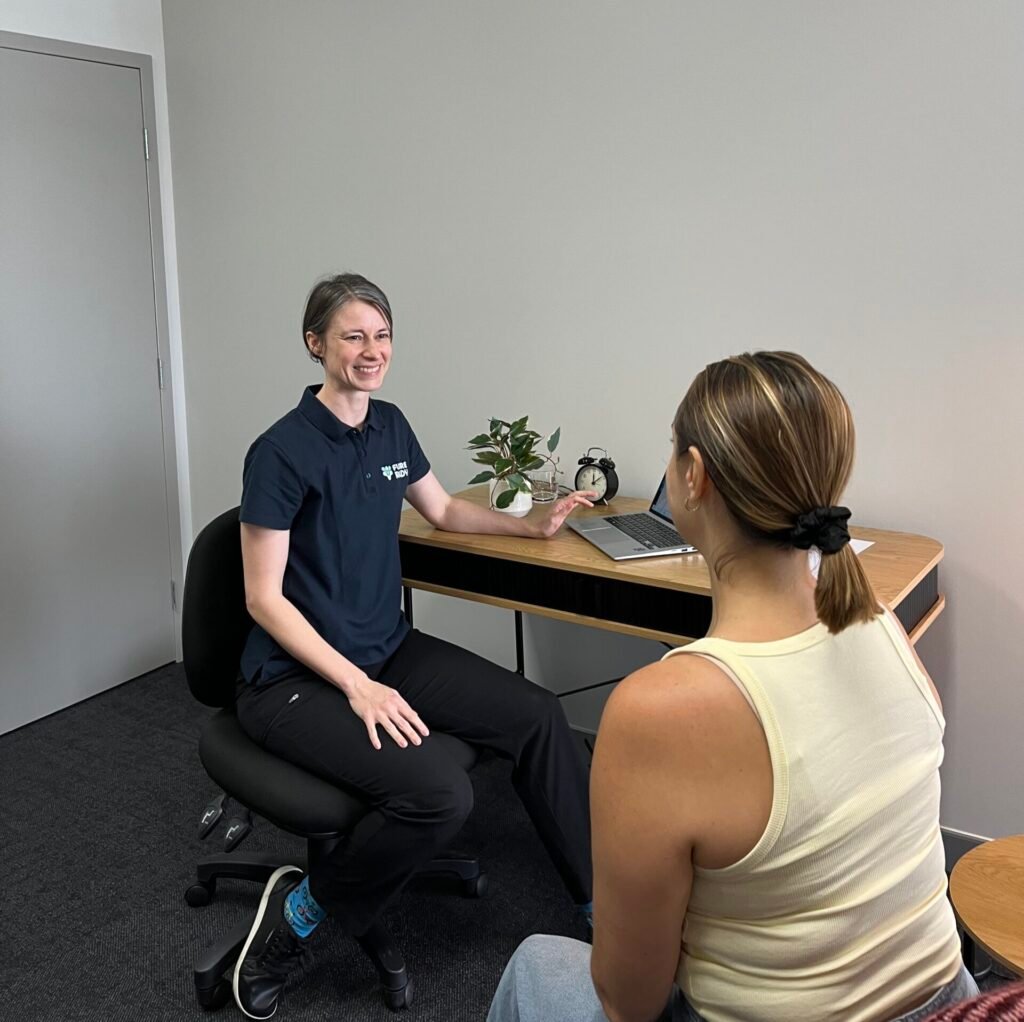 Physiotherapist talking to a client